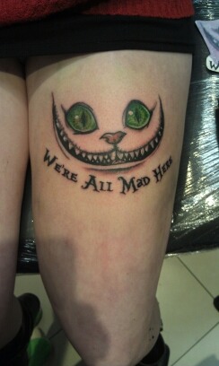 Where All Mad Here Creepy Cat Tattoo On Left Thigh
