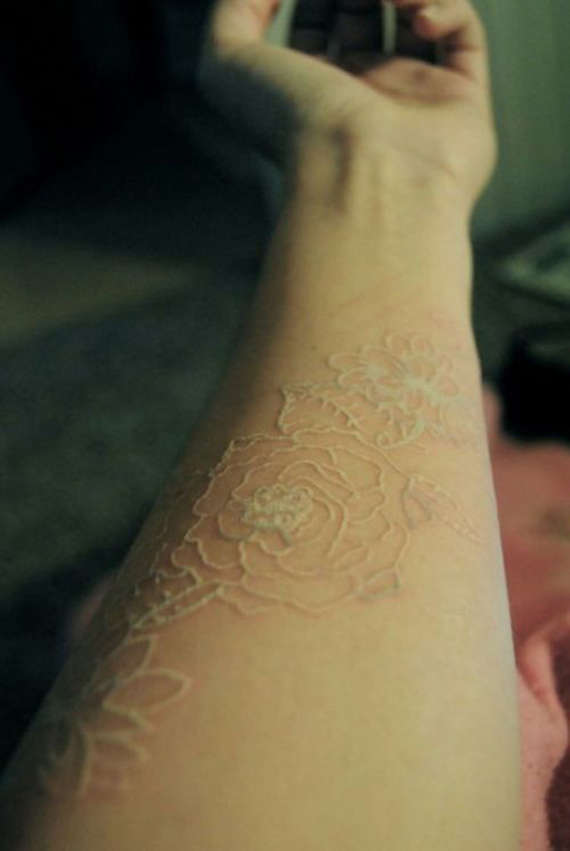 White Ink Roses Tattoo On Left Forearm