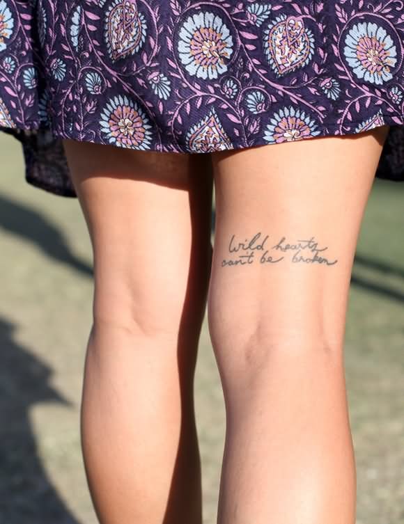 Wild Heart Can't Be Broken Quote Tattoo On Upper Leg