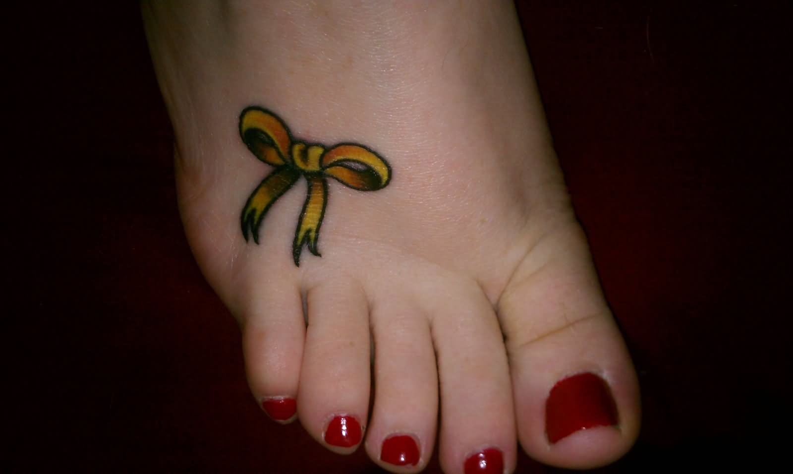 Yellow Ribbon Tattoo On Girl Right Foot
