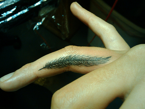 Amazing Feather Tattoo On Finger