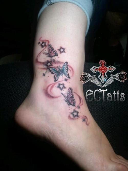 Attractive Flying Butterflies With Stars Tattoo On Ankle