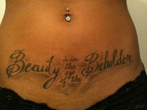 Beauty Is On The Eye Of The Beholder Tattoo On Stomach