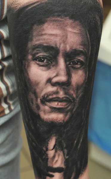 Black And Grey Bob Marley Tattoo On Left Forearm