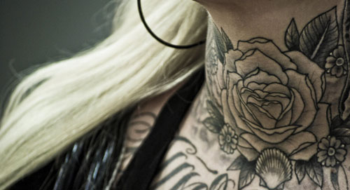 Black And Grey Flower Tattoo On Girl Front Neck