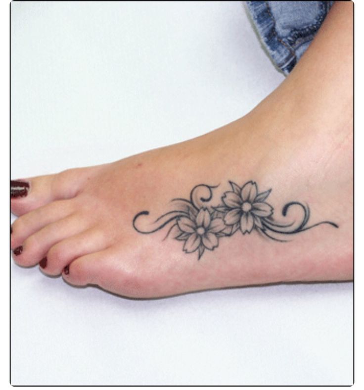Black And Grey Flowers Tattoo On Girl Left Foot