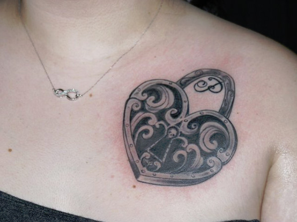 Black And Grey Gothic Heart Lock Tattoo On Girl Left Front Shoulder