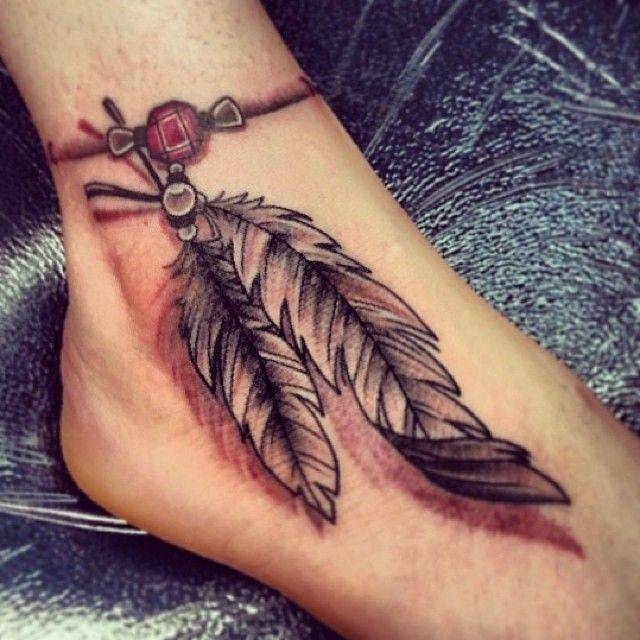 Black And Grey Rosary Feathers Tattoo On Foot
