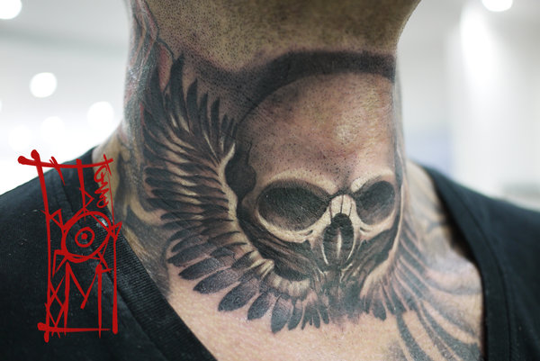 Black And Grey Skull With Wings Tattoo On Man Neck