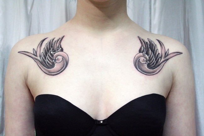 Black And Grey Two Flying Bird Tattoo On Girl Collar Bone