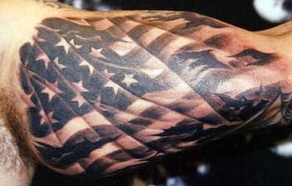 Black And Grey USA Flag Tattoo On Left Bicep