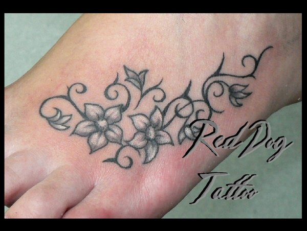 Black And White Flowers Tattoo On Foot By Mr. Red Dog