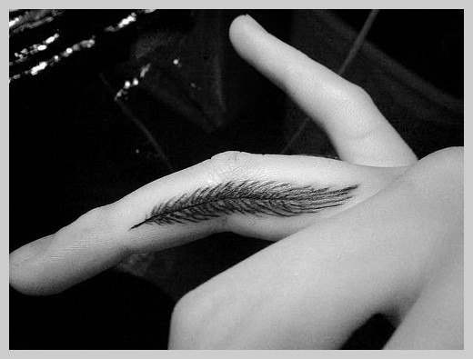 Black Feather Tattoo On Side Finger