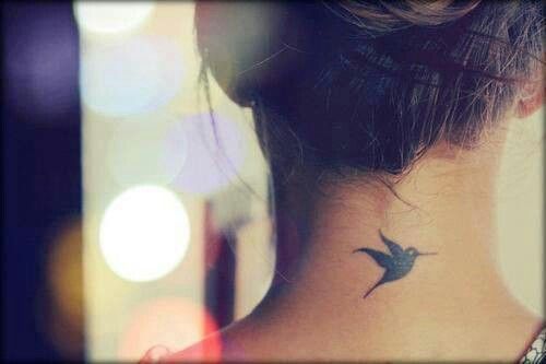 Black Flying Bird Tattoo On Girl Back Neck
