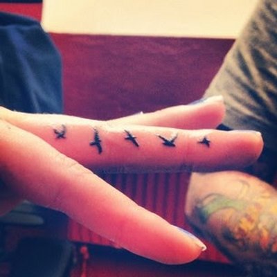 Black Flying Birds Tattoo On Finger