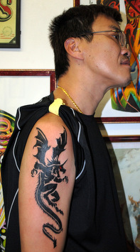 Black Gothic Dragon Tattoo On Man Right Half Sleeve