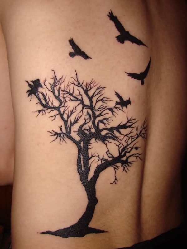 Black Gothic Tree Without Leaves And Flying Birds Tattoo On Back