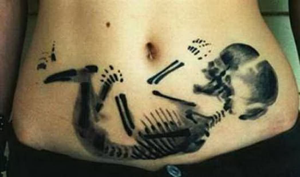 Black Ink Baby Skeleton Tattoo On Stomach