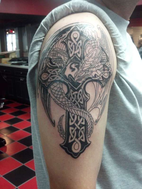 Black Ink Celtic Cross With Gothic Dragon Tattoo On Right Shoulder
