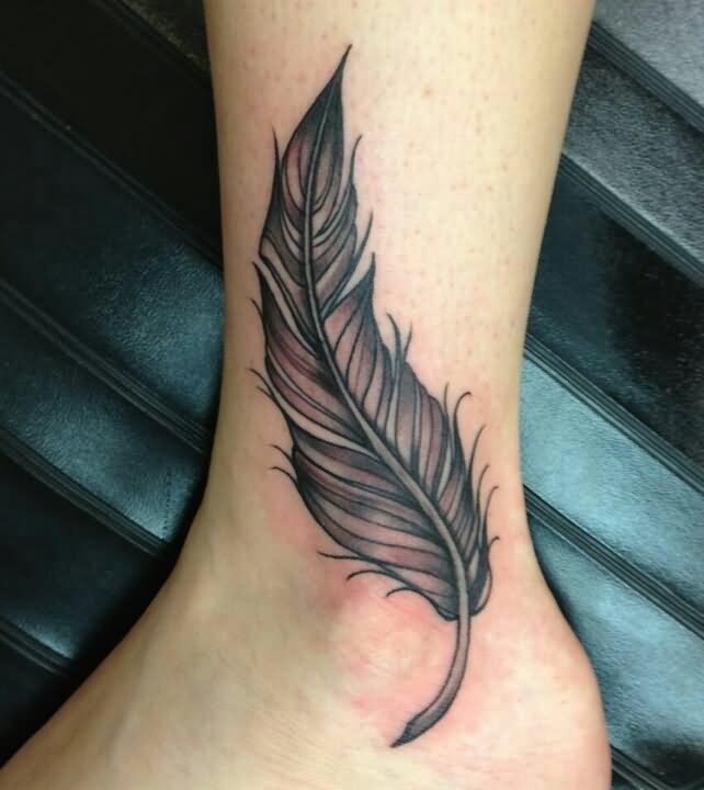 Black Ink Feather Tattoo On Ankle