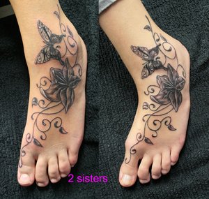 Black Ink Flower With Butterfly Tattoo On Foot