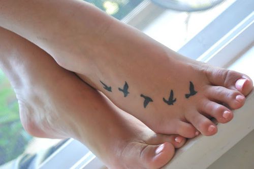 Black Ink Flying Birds Tattoo Design For Foot
