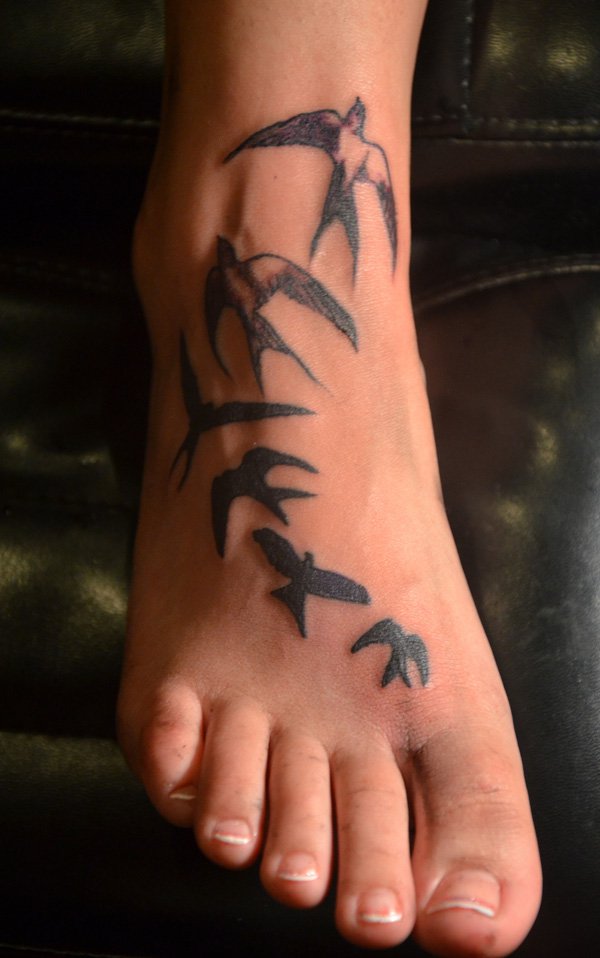 Black Ink Flying Birds Tattoo On Right Foot