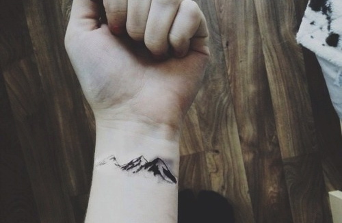 Black Ink Nature Mountains Tattoo On Wrist