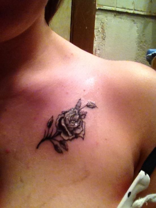 Black Ink Rose Flower Tattoo On Collar Bone