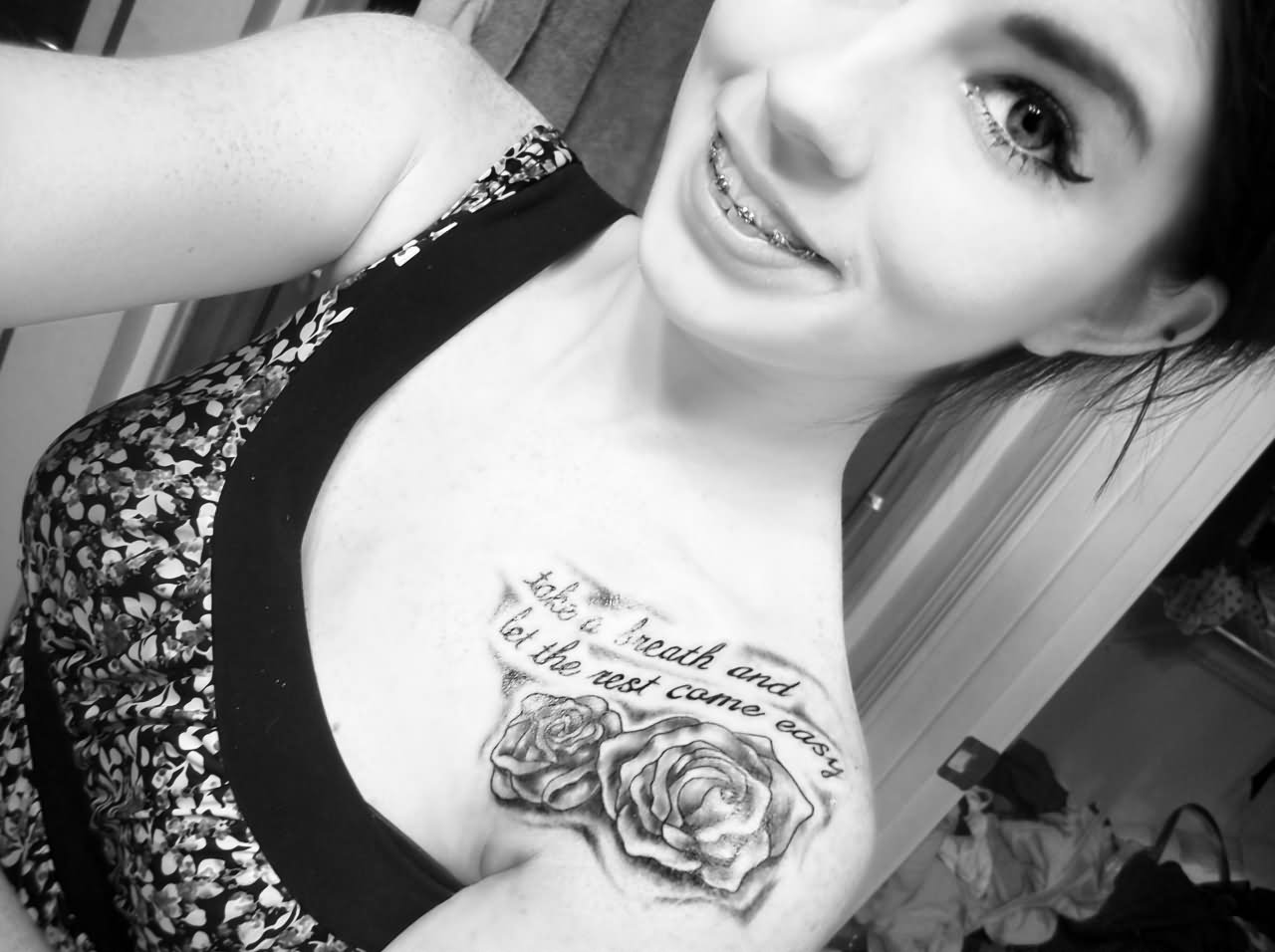 Black Ink Roses With Quote Tattoo On Tattoo Girl Collarbone