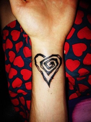 Black Ink Spiral Gothic Heart Tattoo On Wrist