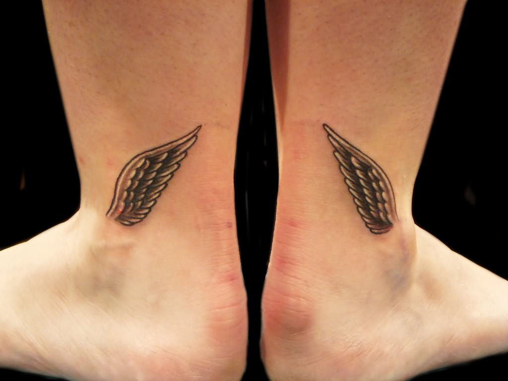 Black Ink Wings Tattoo On Ankle