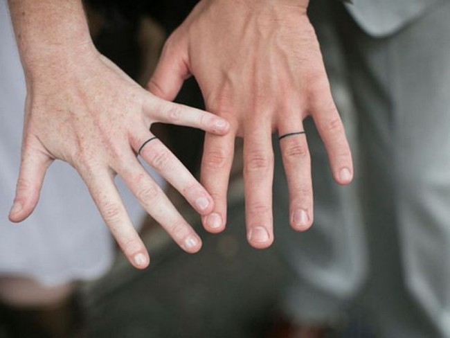 Black Line Tattoo On Couple Finger