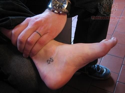 Black Little Infinity Tattoo On Inner Ankle