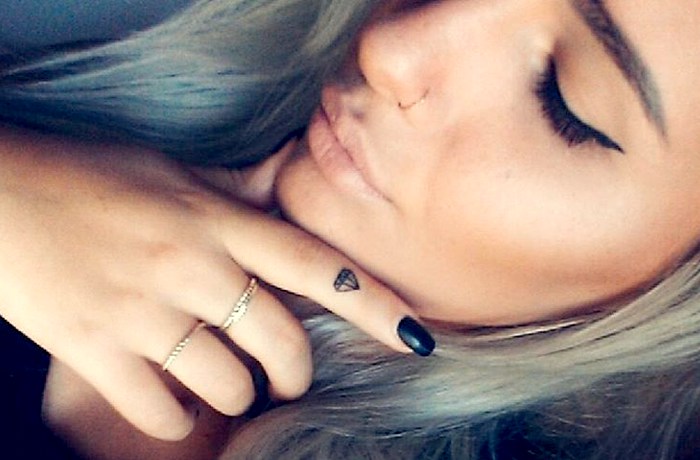 Black Outline Diamond Tattoo On Girl Finger