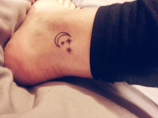 Black Outline Half Moon With Stars Tattoo On Ankle