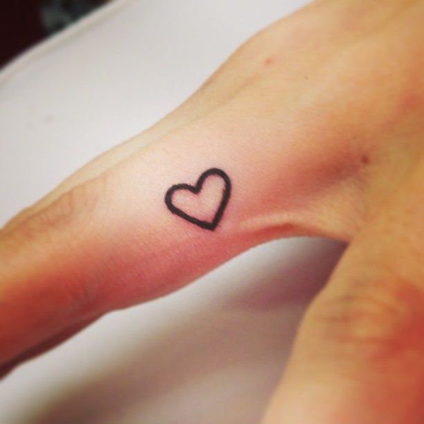 Black Outline Heart Tattoo On Finger