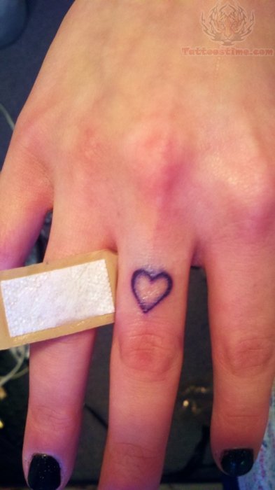 Black Outline Heart Tattoo On Girl Middle Finger
