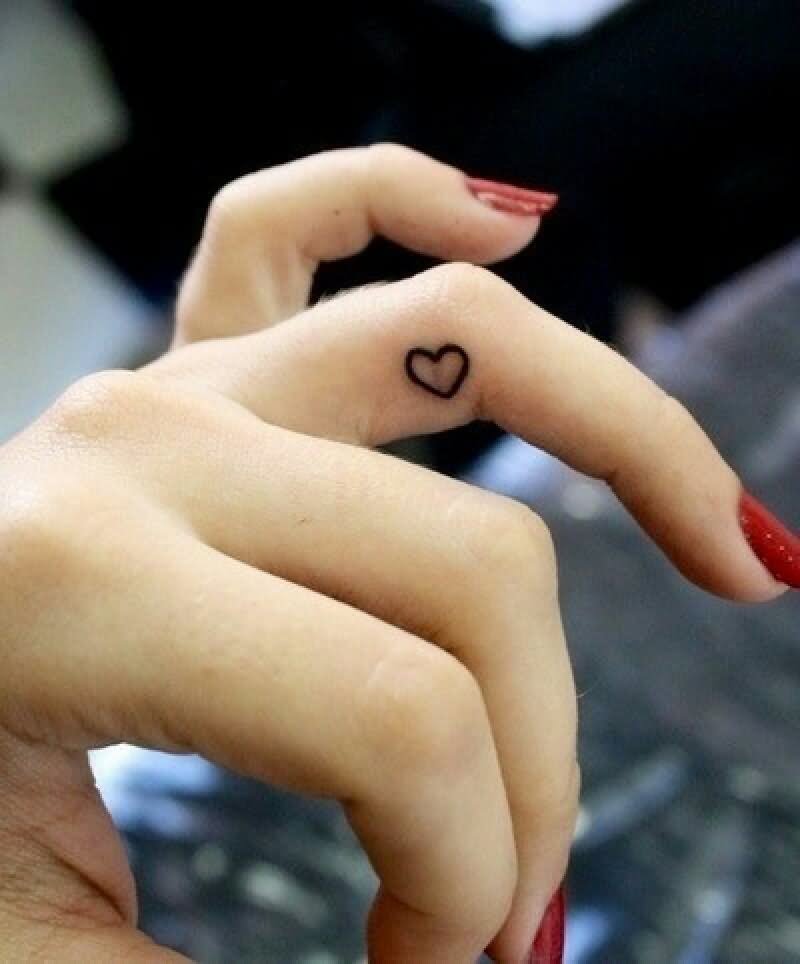 Black Outline Heart Tattoo On Girl Side Finger