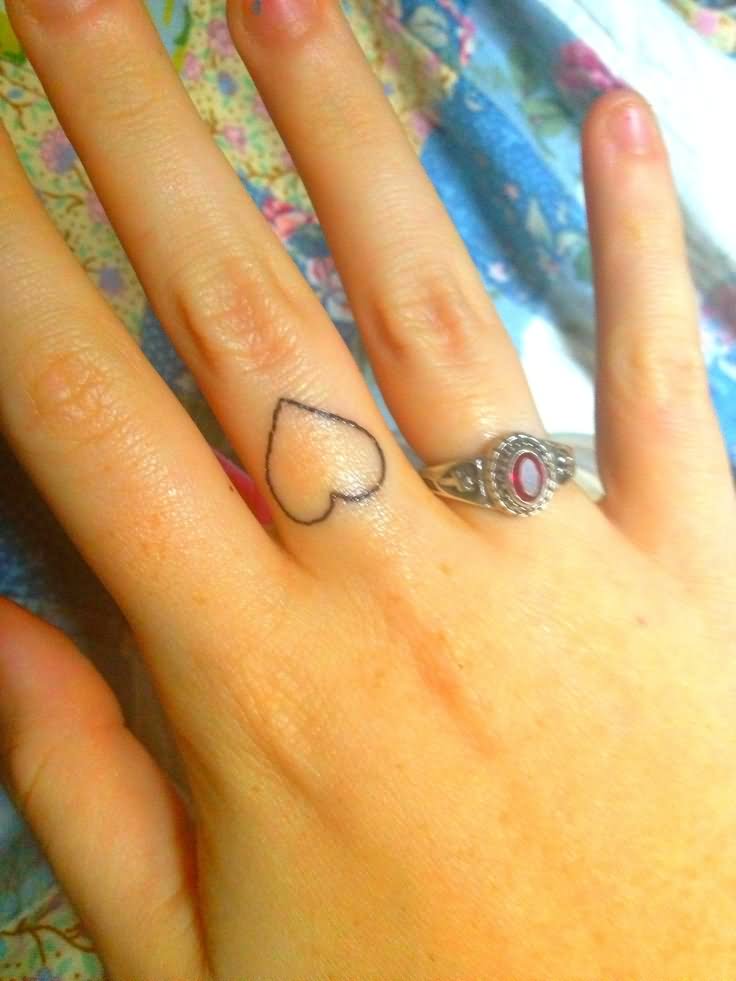 Black Outline Heart Tattoo On Middle Finger