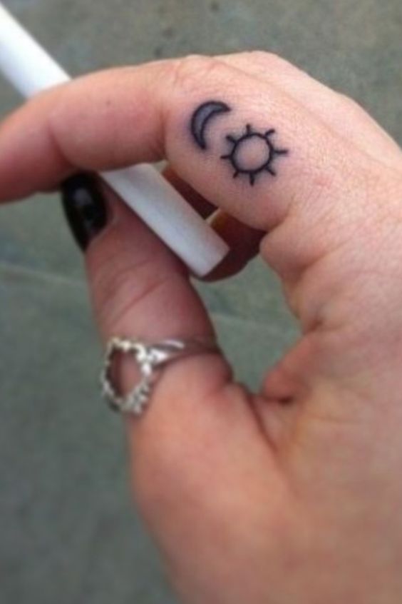 Black Outline Sun And Half Moon Tattoo On Girl Finger