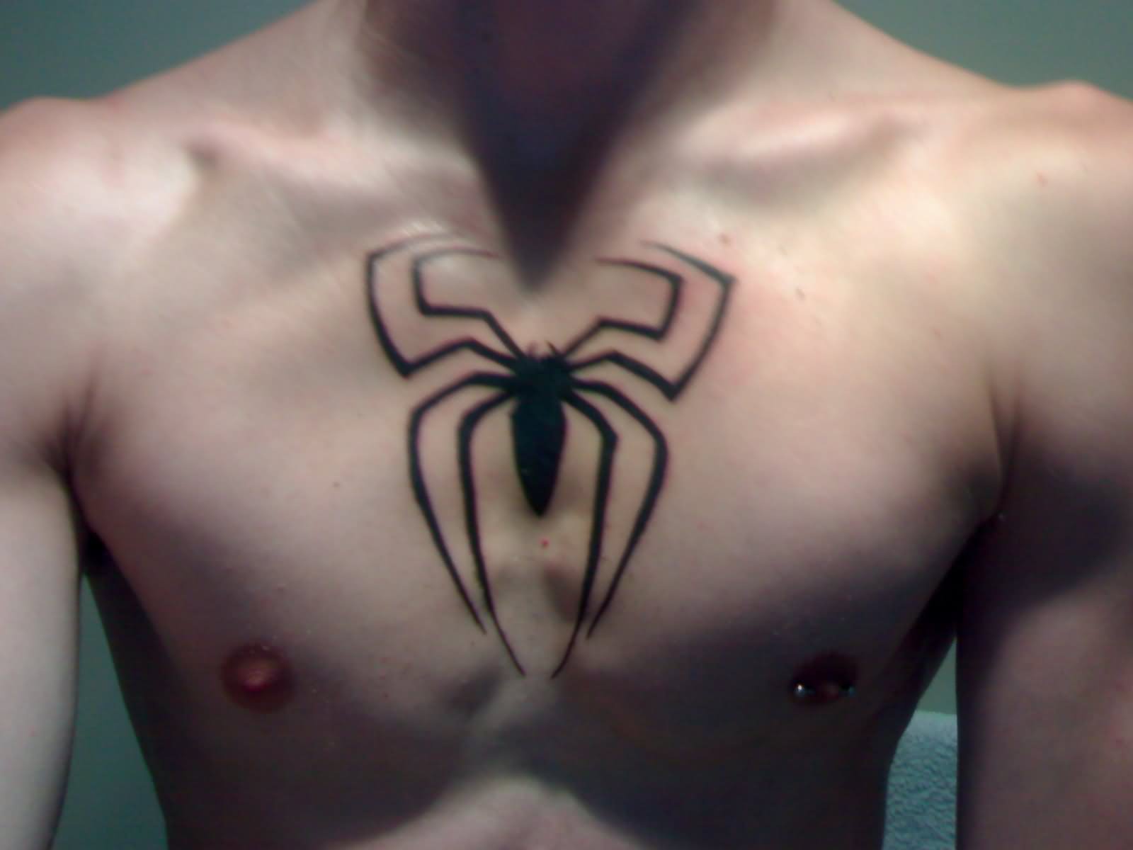 Black Spiderman Logo Tattoo On Man Chest