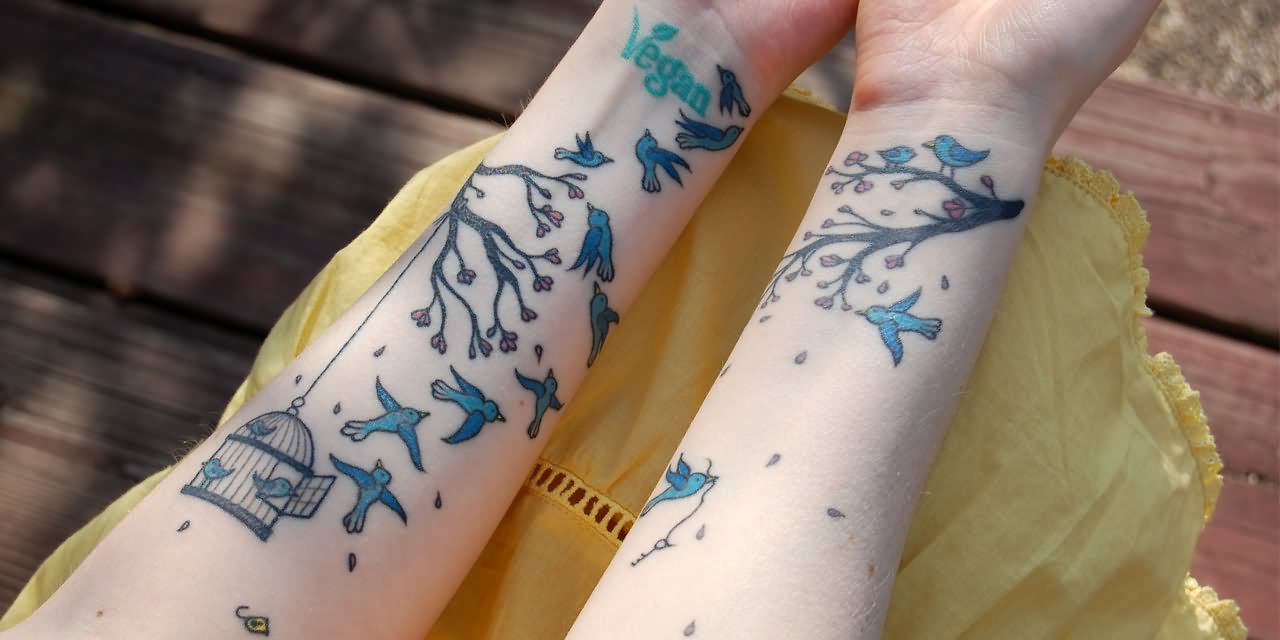 Blue Flying Birds And Cage Tattoo On Forearm