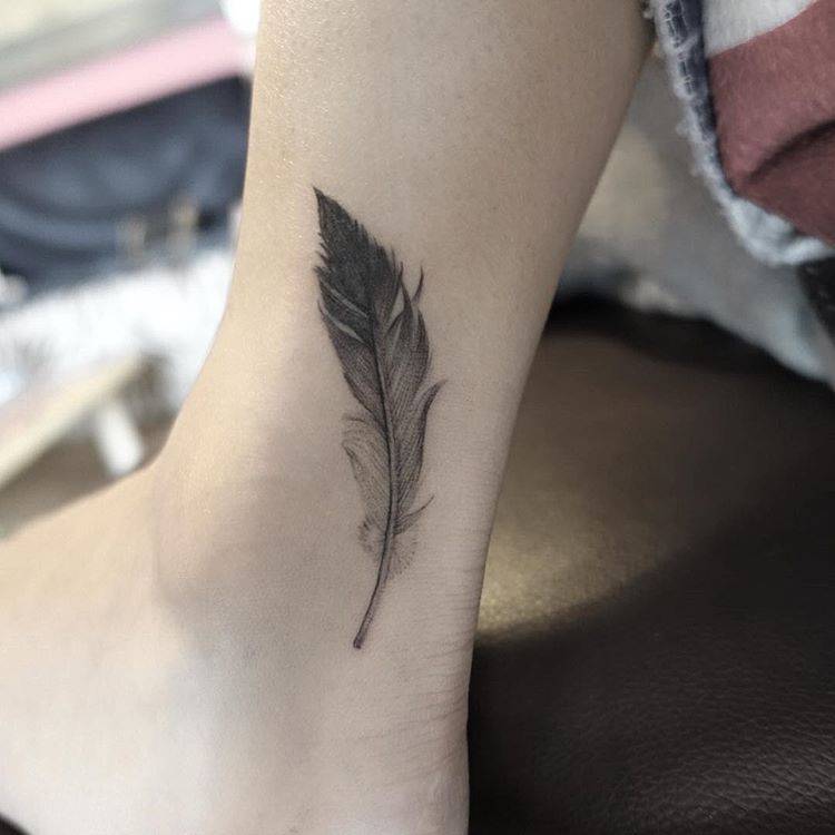 Classic Grey Ink Feather Tattoo On Ankle