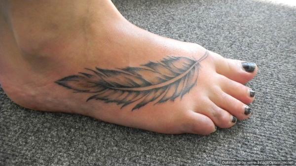 Classic Grey Ink Feather Tattoo On Right Foot