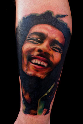Colored Bob Marley Tattoo On Arm