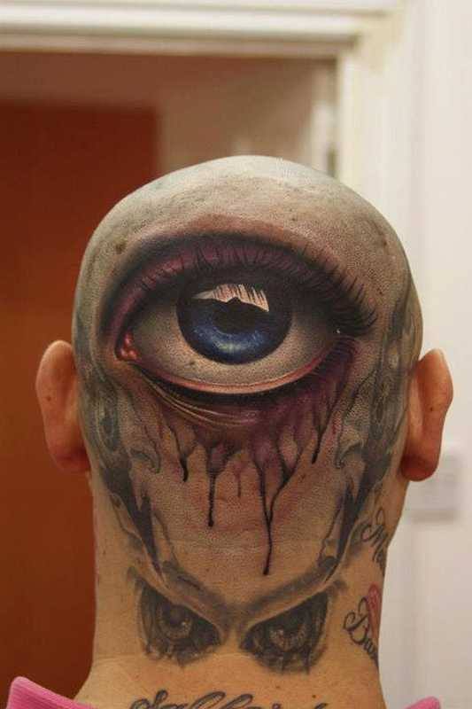 Colored Eye Ripped Skin Tattoo On Head