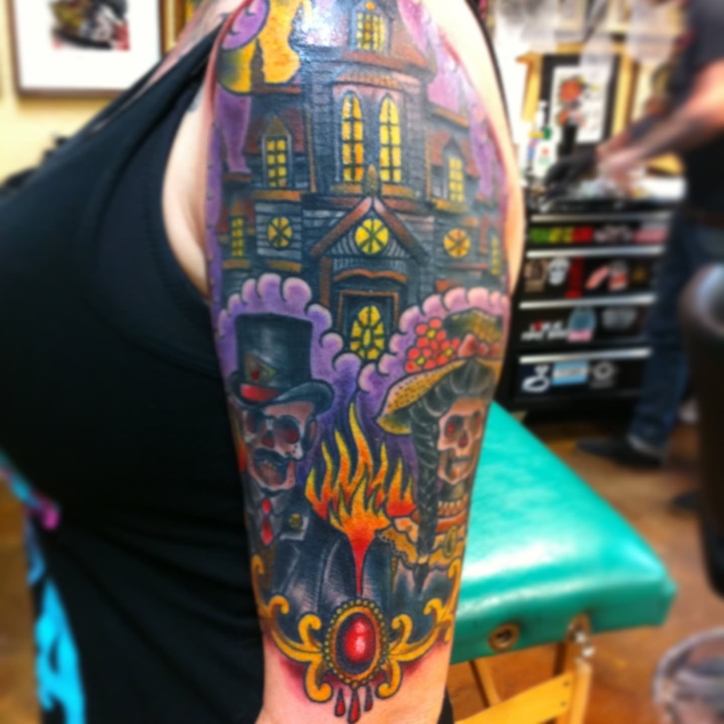 Colored Traditional Haunted House Tattoo On Left Half Sleeve