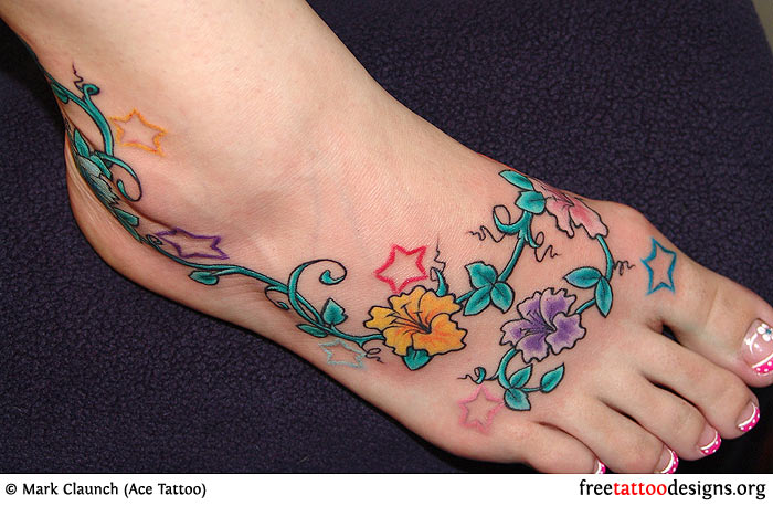 Colorful Flowers And Stars Tattoo On Right Foot