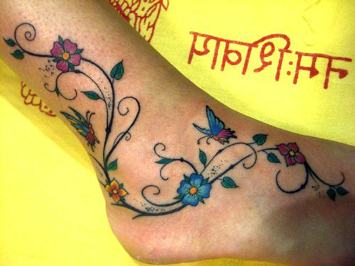 Colorful Flowers With Butterflies Tattoo On Ankle